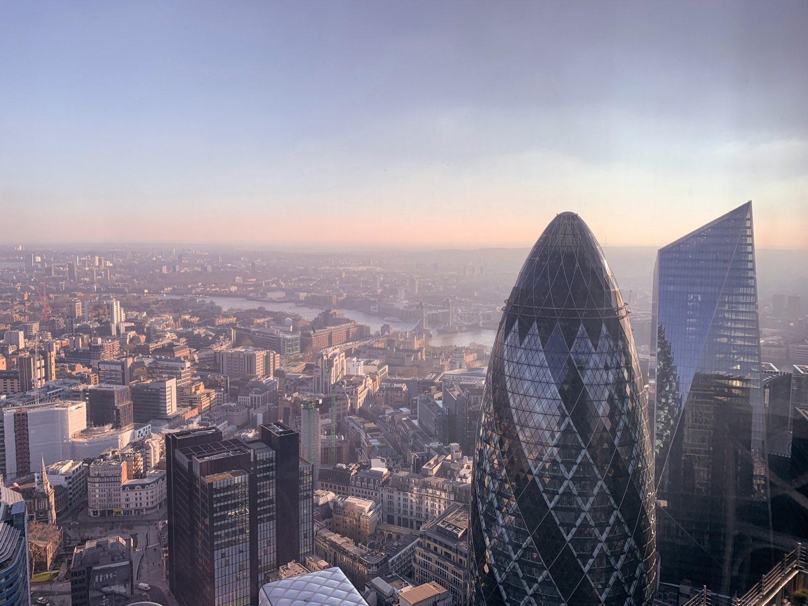 The City of London seen from above at dusk.
